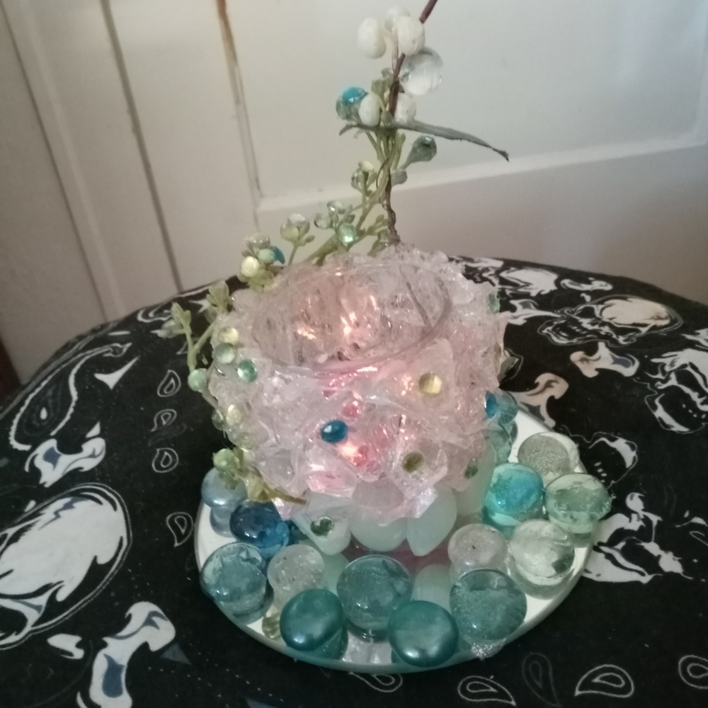 Beautiful glass tea light holder with Jems and floral glow in dark rocks.